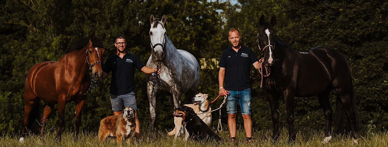 Chris and Terry with their horses and dogs